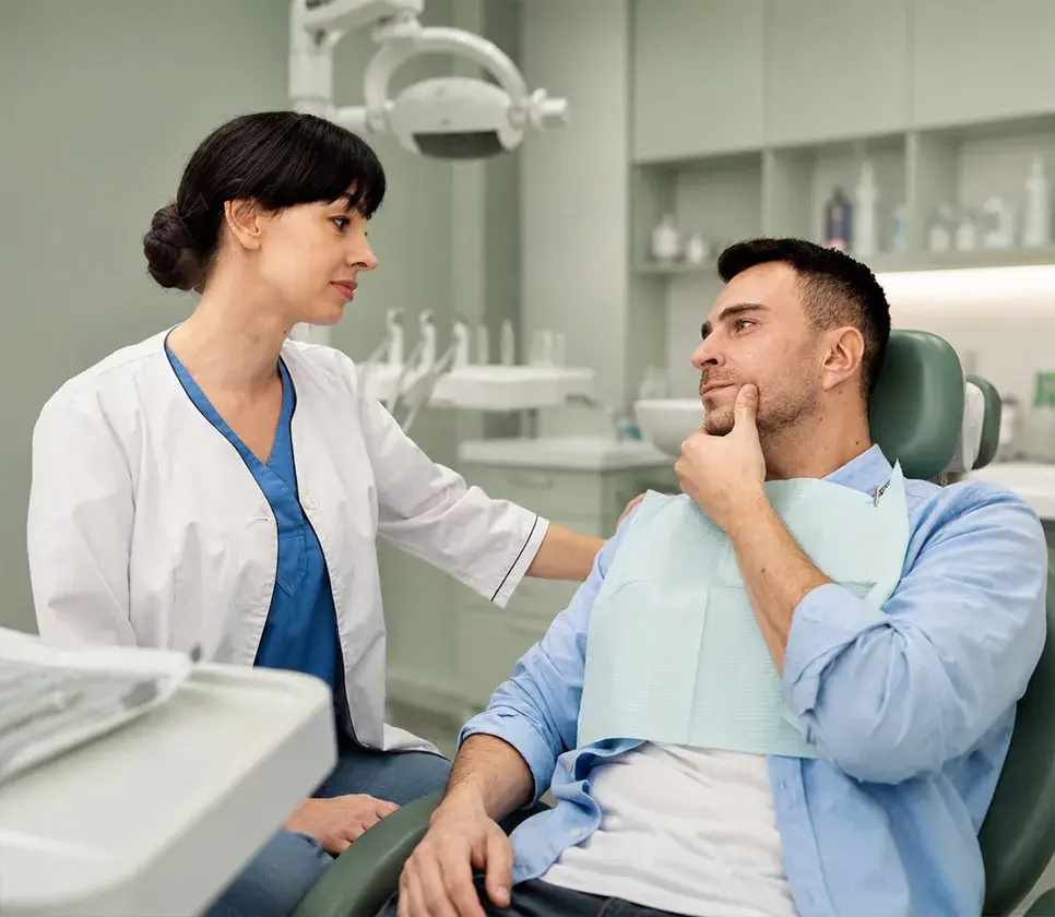 Patient receiving a dental check-up in the clinic