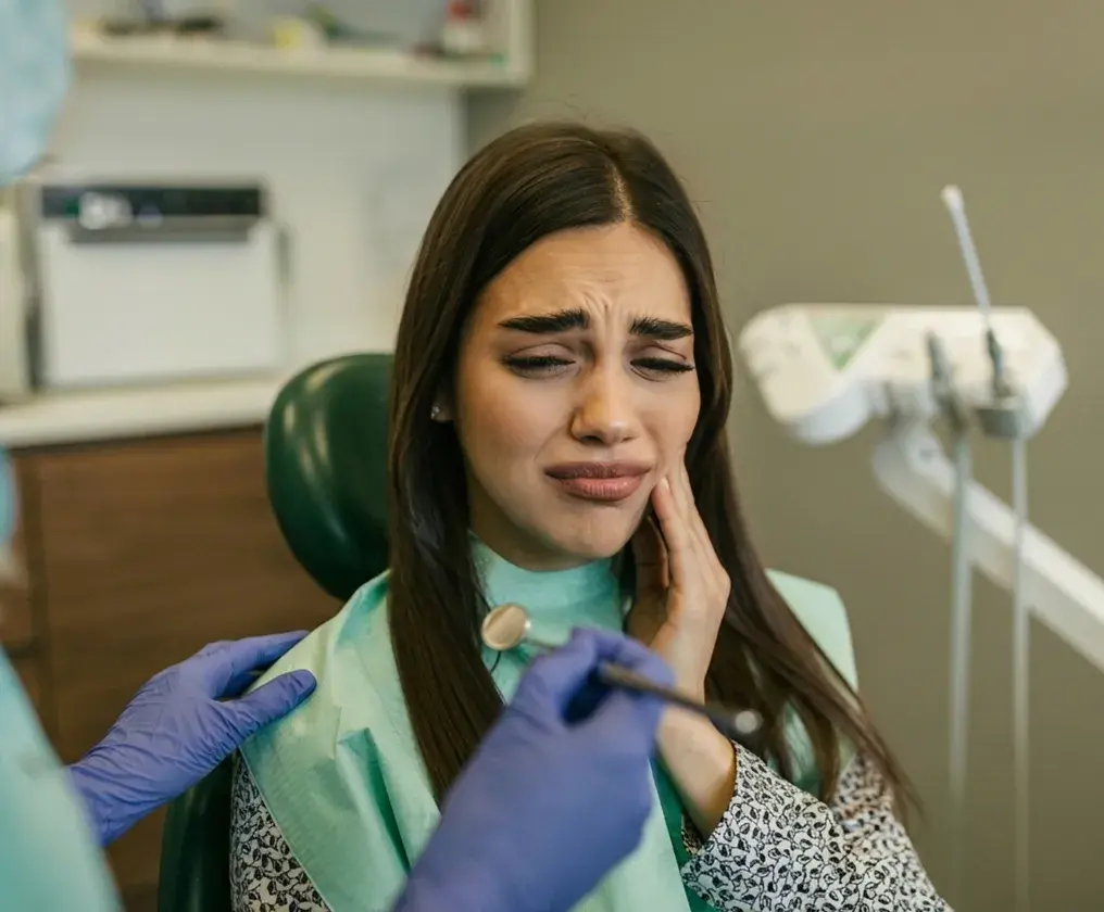 A friendly team member taking a call at the East St Kilda Dental reception